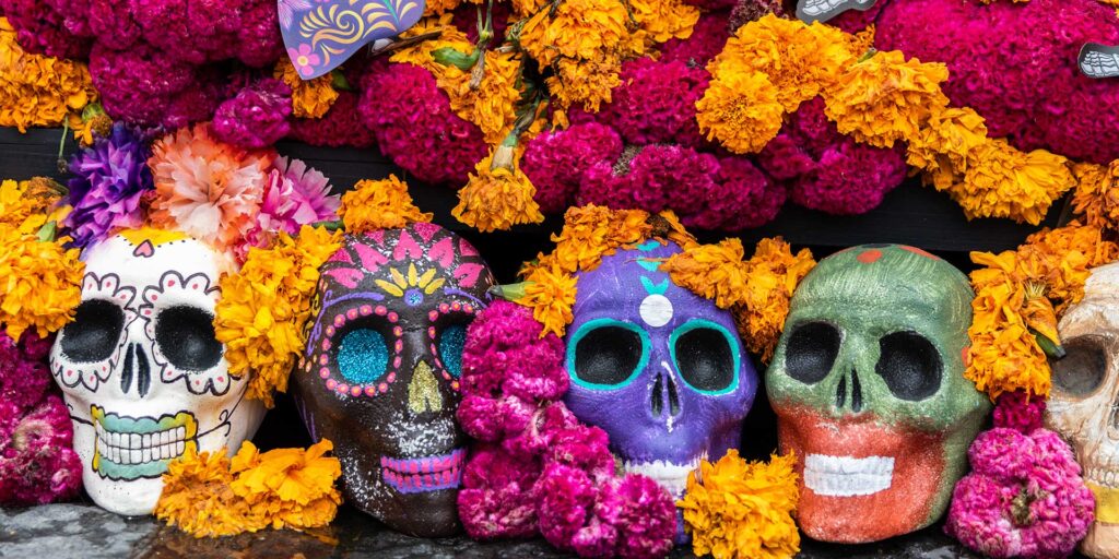 Dia De Los Muertos decoration including sugar skulls and marigold flowers