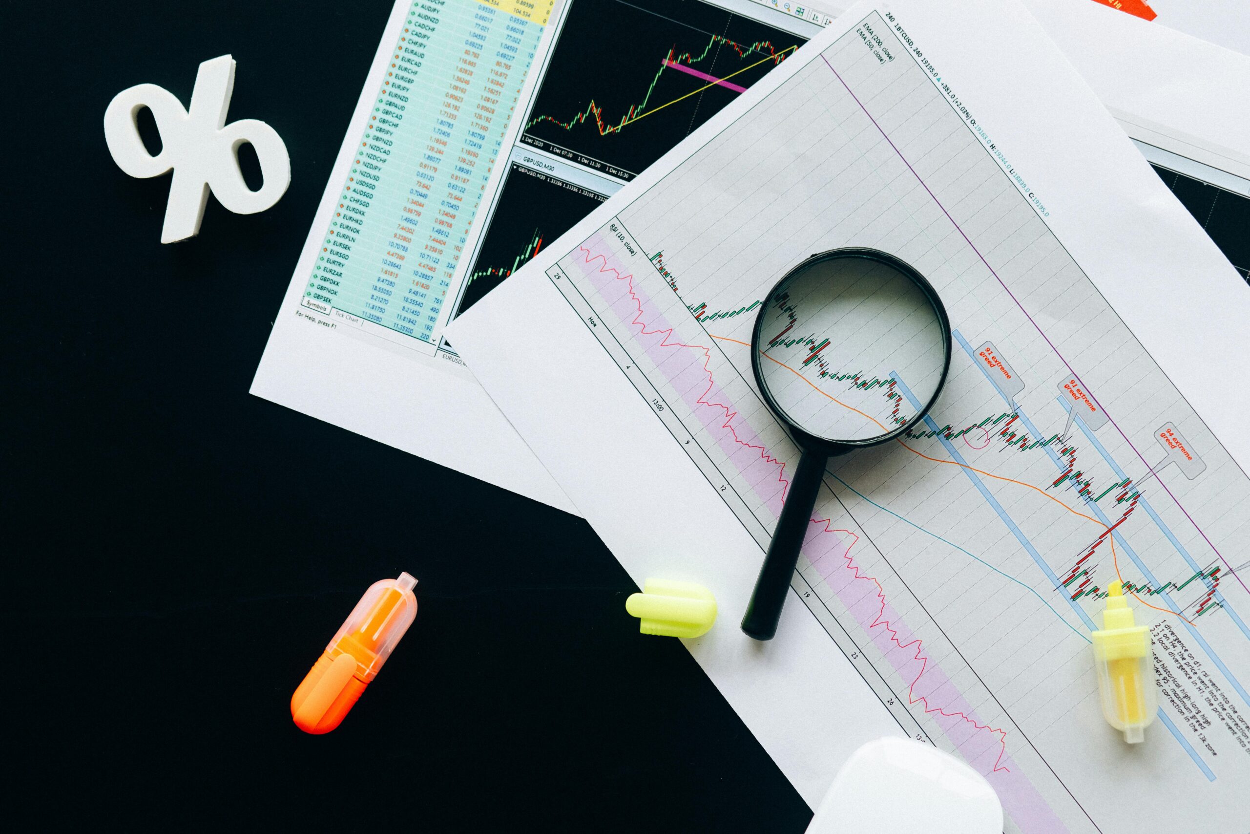 Reviewing expenses for tax deductions using spreadsheets and a microscope